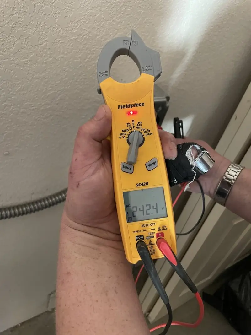 Voltage testing with clamp meter during Ceiling Fan Installation in Northfield